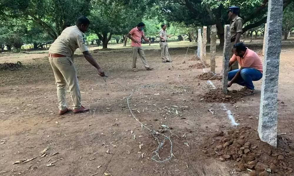 Police personnel removing cockfight arena at Gopalapuram village of A Konduru mandal in Krishna district on Tuesday