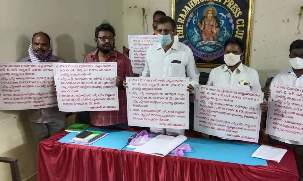 Adivasi leaders releasing brochure at Press Club in Rajamahendravaram on Tuesday