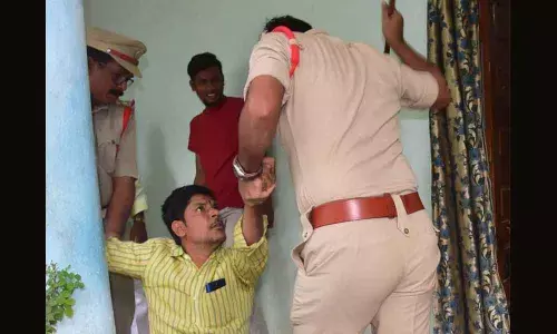 Cops cane BJP workers