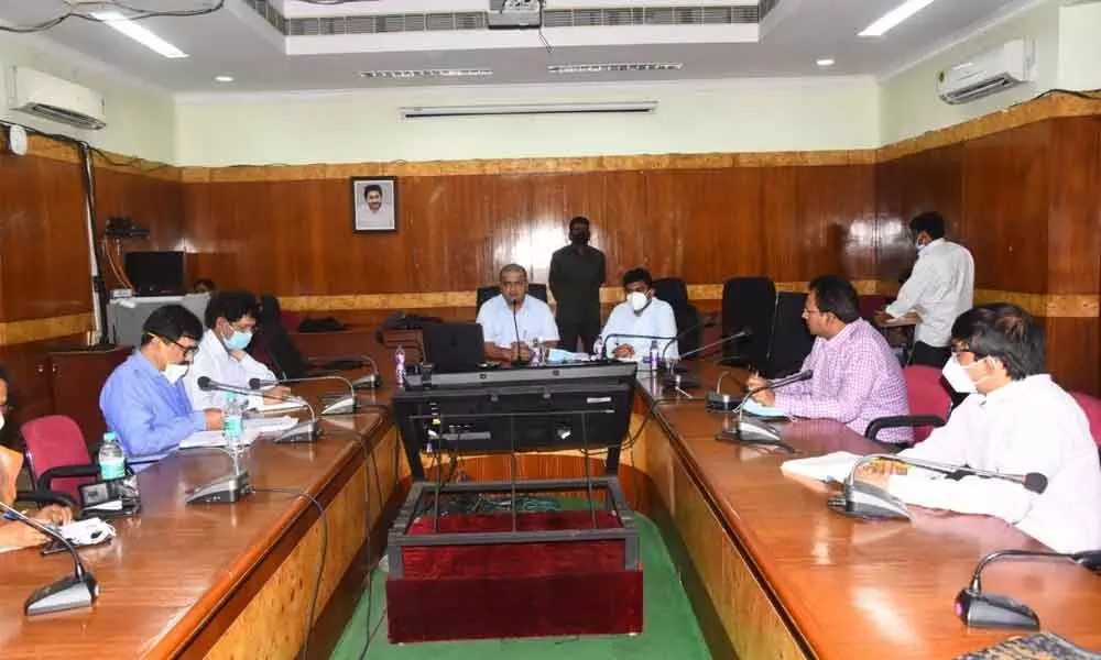 District Collector V Vinay Chand speaking at a review meeting in Visakhapatnam