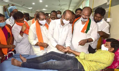 BJP State president Bandi Sanjay Kumar interacting with the party workers
