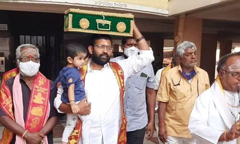 Rajanagaram MLA Jakkampudi Raja carrying Tiruvabharanalu to Swamy Ayyappa temple from his house on Thursday