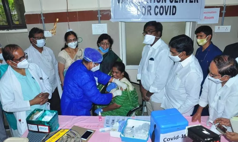 Transport Minister Puvvada Ajay Kumar and MP Nama Nageswara Rao overseeing the Covid vaccination process after its launch in Khammam on Saturday