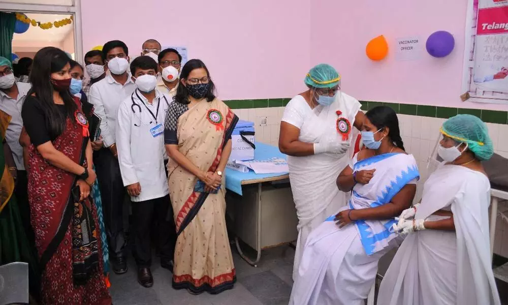 A health worker taking corona vaccine in Yadadri-Bhongir district on Saturday