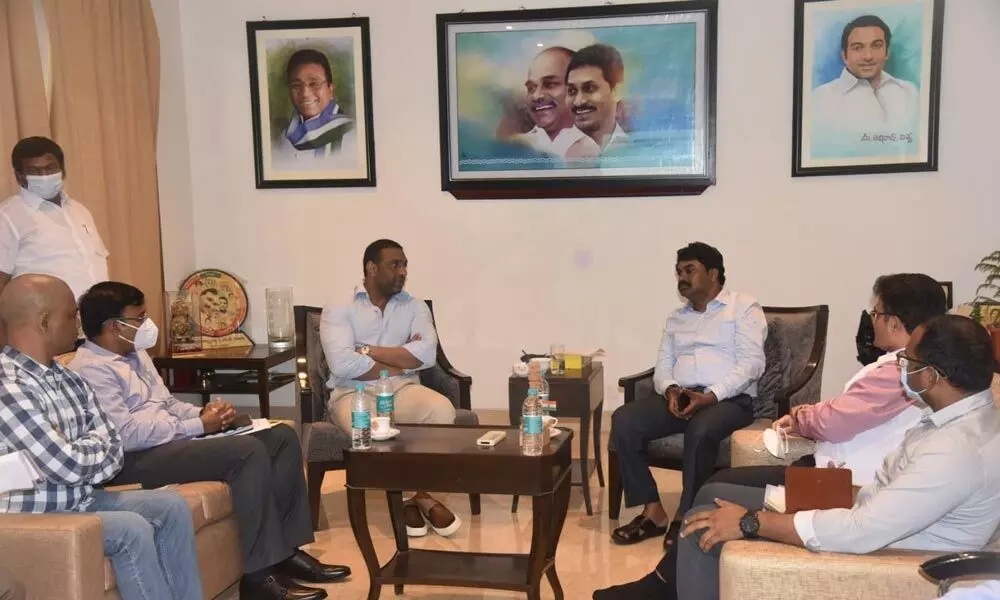 Minister Mekapati Goutham Reddy conducting a review with government officials and representatives  of Midhani at his camp office in Nellore on Saturday.  DRDO Chairman  Dr G Satish Reddy  is seen.
