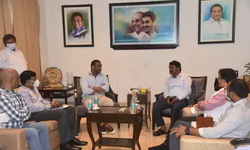 Minister Mekapati Goutham Reddy conducting a review with government officials and representatives  of Midhani at his camp office in Nellore on Saturday.  DRDO Chairman  Dr G Satish Reddy  is seen.