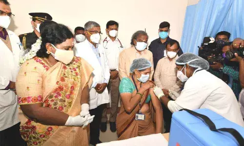 Governor Tamilisai Soundararajan taking a look at the vaccination being conducted at NIMS Hospital