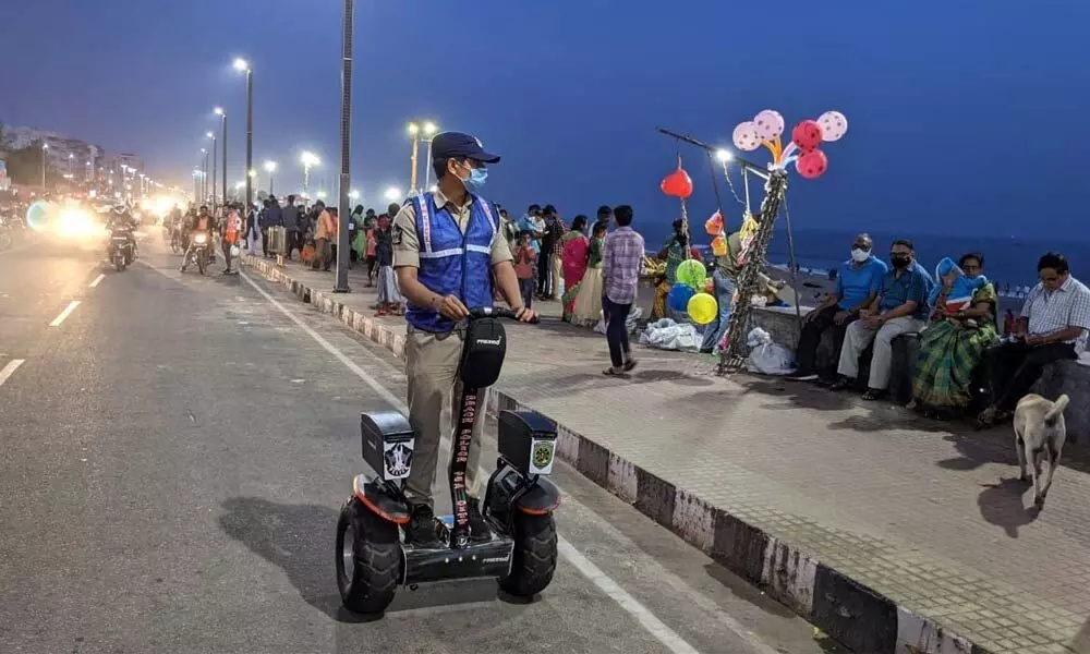 Police personnel patrolling on a segway at Beach Road in Visakhapatnam.
