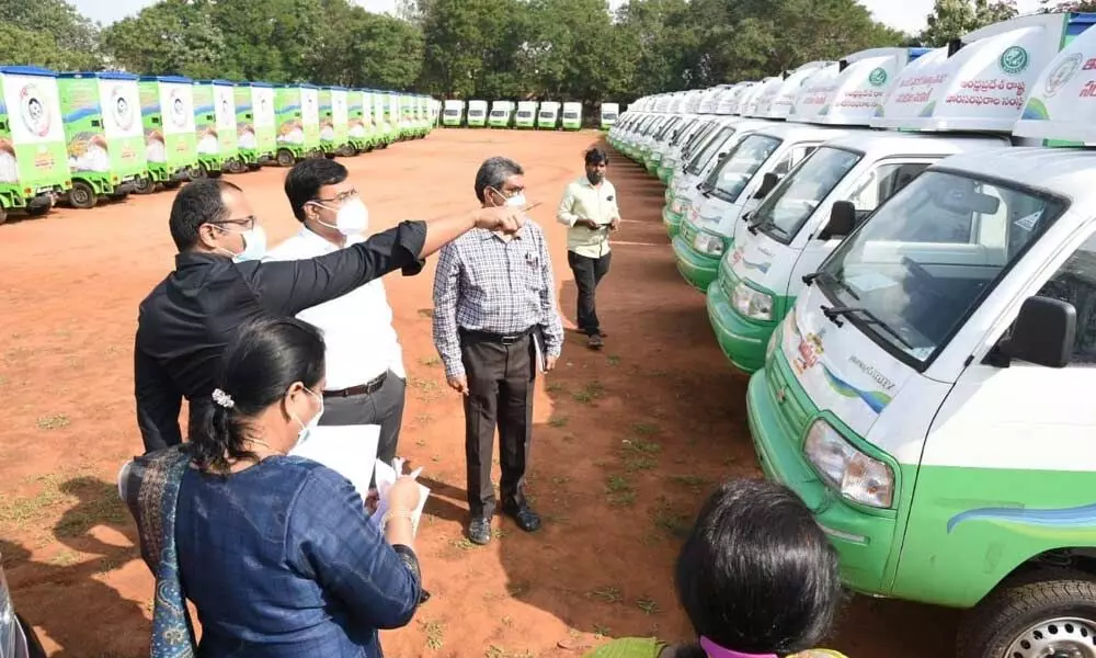 District Collector K V N Chakradhar Babu inspecting the vehicles meant for rice distribution at ACSR stadium in Nellore on Sunday
