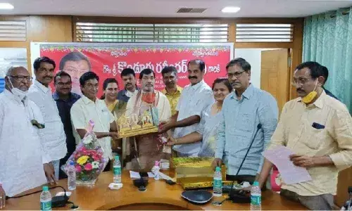 Telangana State Cooperative Bank Employees Association members felicitating NAFSCOB chairman Konduru Ravinder Rao at a programme in Karimnagar on Saturday night