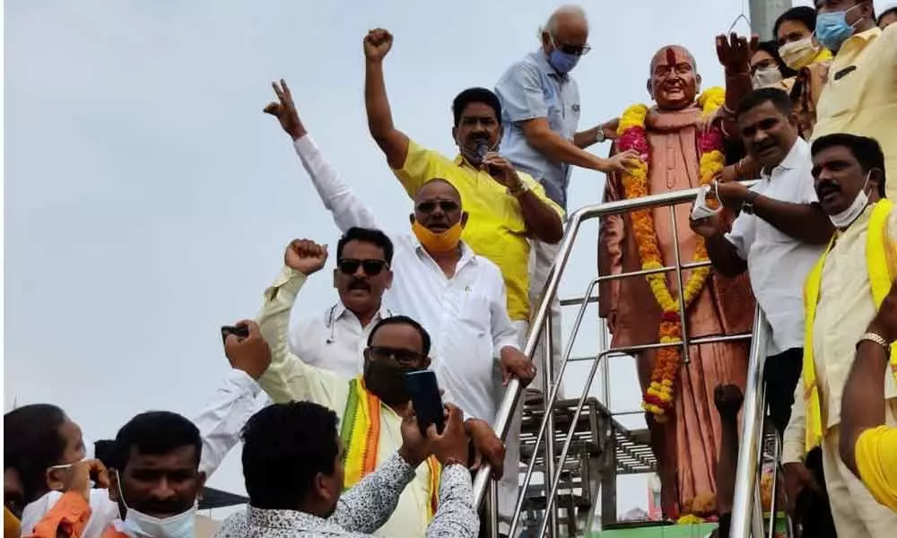 TDP politburo member P Ashok Gajapathi Raju garlanding the statue of party founder N T Rama Rao on the occasion of his 25th death anniversary in Vizianagaram on Monday