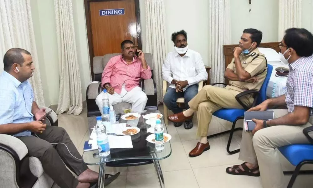 Tourism Minister M Srinivasa Rao, District Collector V Vinay Chand and City Police Commissioner Manish Kumar Sinha at a meeting in Visakhapatnam on Tuesday