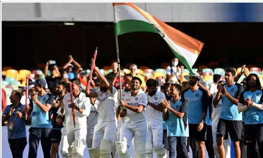 Indian players celebrate after defeating Australia by three wickets on the final day of the fourth Test match at the Gabba, Brisbane, Australia on Tuesday
