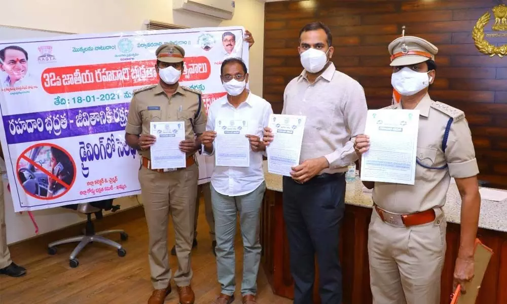 District Collector RV Karnan and RTO T Kishan Rao releasing pamphlets and posters on road safety commemorating Road Safety Month in Khammam on Wednesday