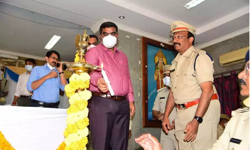 District Collector G Veera Pandiyan lighting the lamp to mark the inauguration of 32nd National Road Safety Month celebrations at Zilla Parishad Conference in Kurnool