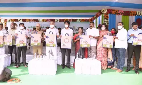 Minister Chelluboina Venu Gopala Krishna and others at the launch of vehicles in Kakinada on Thursday