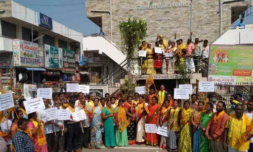 TDP leaders and workers protesting in front of the Mahatma Gandhi statue in Ongole on Thursday