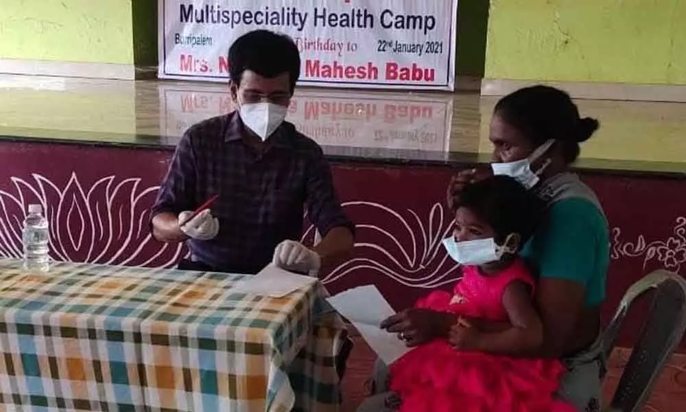 Doctor examining patient at the health camp