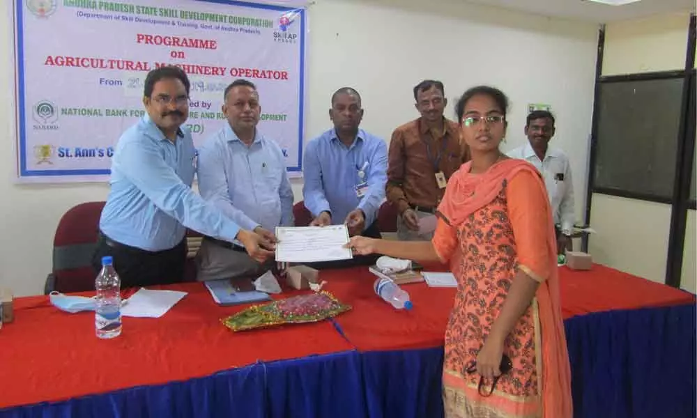 Management of SACET Chirala and skill development officials presenting certificates to the successful candidates on Frday