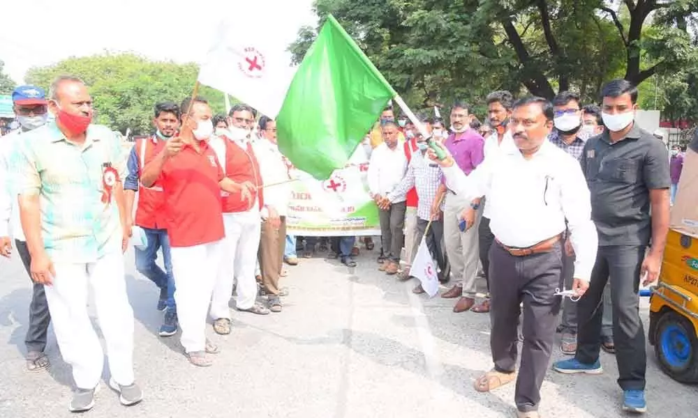 Collector Dr Pola Bhaskara flagging off  Indian Red Cross rally in Ongole on Friday