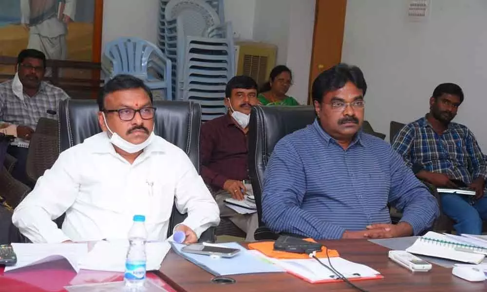 Collector Dr Pola Bhaskara and Joint Collector JV Murali participating in the videoconference with the Chief Electoral Officer on Friday