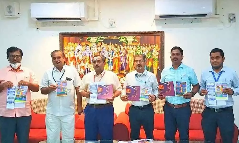 IRCTC General Manager K Ravi Kumar, DGM Kishore Sathya, Station Director S Naga Ramana Sarma and others releasing the tour brochures in Tirupati on Friday