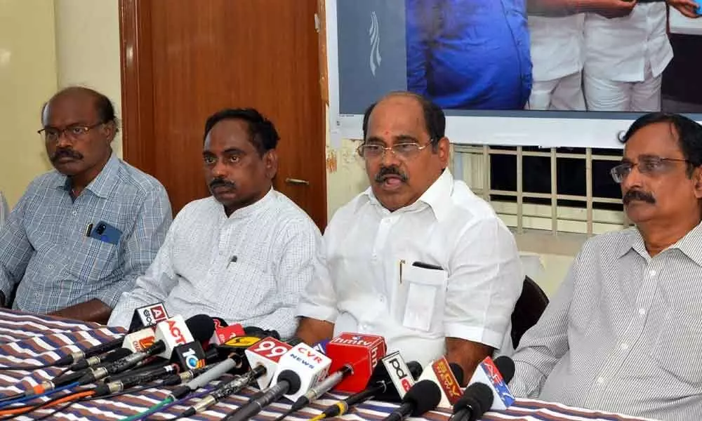 APNGO State president N Chandra Sekhar Reddy and other leaders addressing  a press conference in Vijayawada on Saturday
