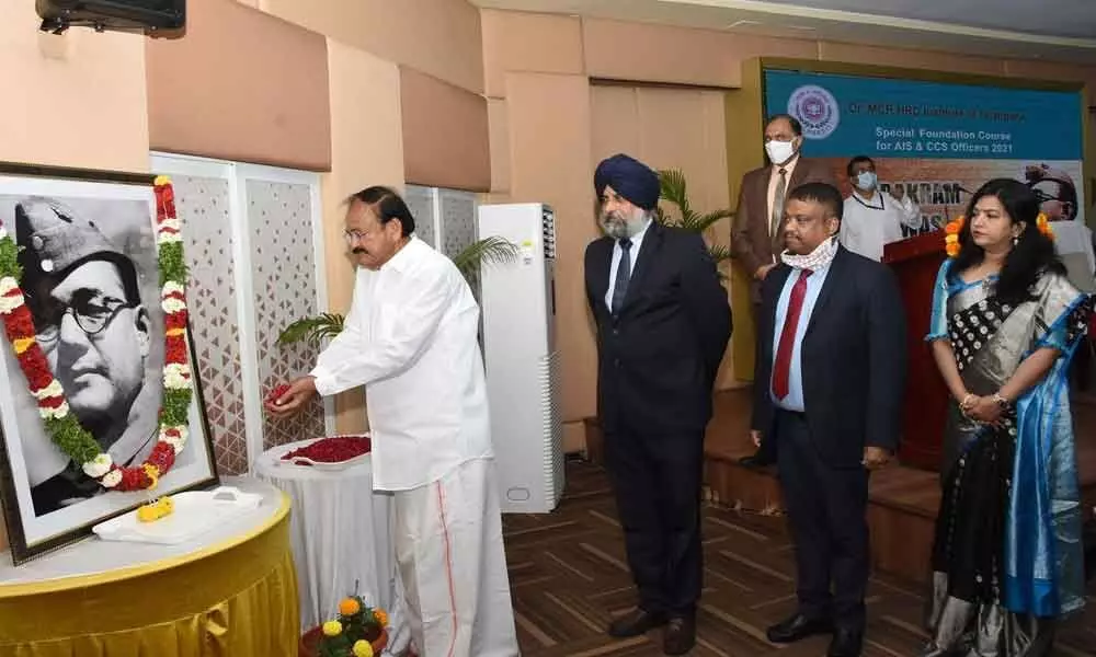 Vice President Venkaiah Naidu paying floral tributes to portrait of Netaji Subhas Chandra Bose on his 125th birth anniversary celebrations at Dr MCR HRD Institute in Hyderabad on Saturday