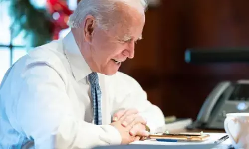 Biden signs executive orders to expand food stamps, up federal pay
