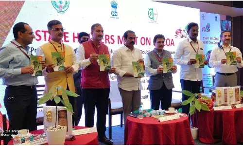 Agriculture Minister K Kannababu and others releasing a brochure on protection of cocoa crop at a workshop in Vijayawada