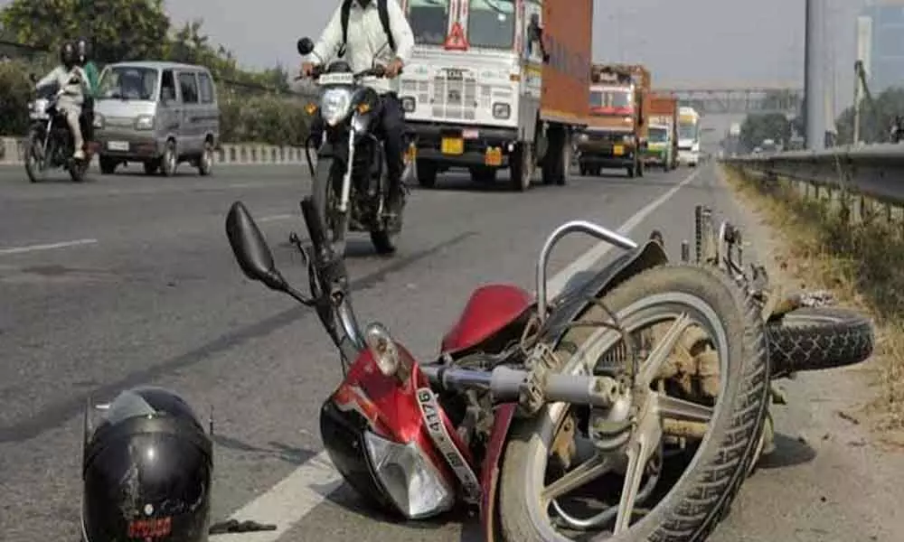 Father and son dies in a bike and RTC bus collision in Kadapa