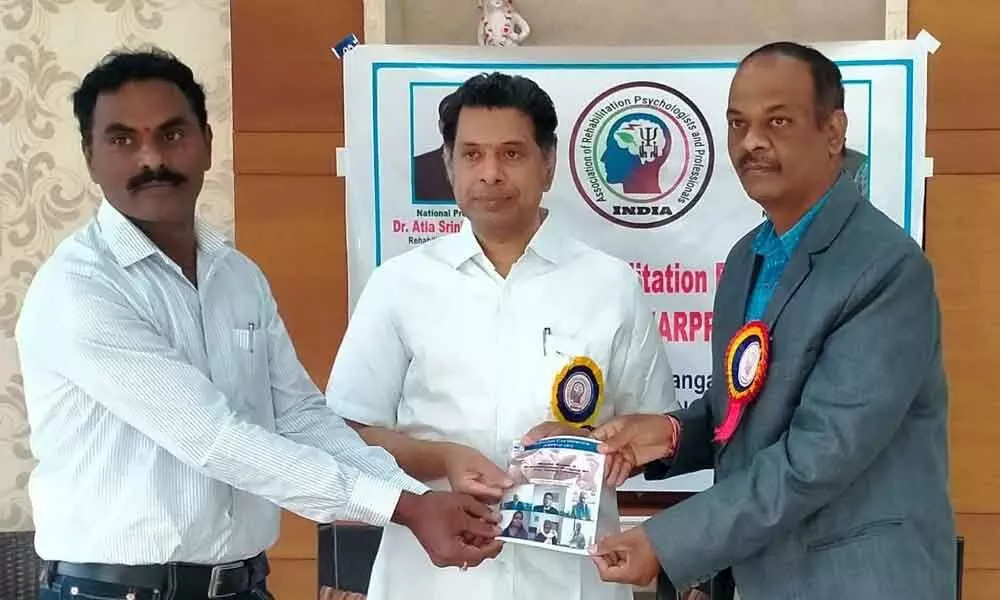 IMA former president Dr Adavelli Vijayendar Reddy releasing Souvenir of ‘Mental Health and Rehabilitation’ at a programme in Karimnagar on Sunday