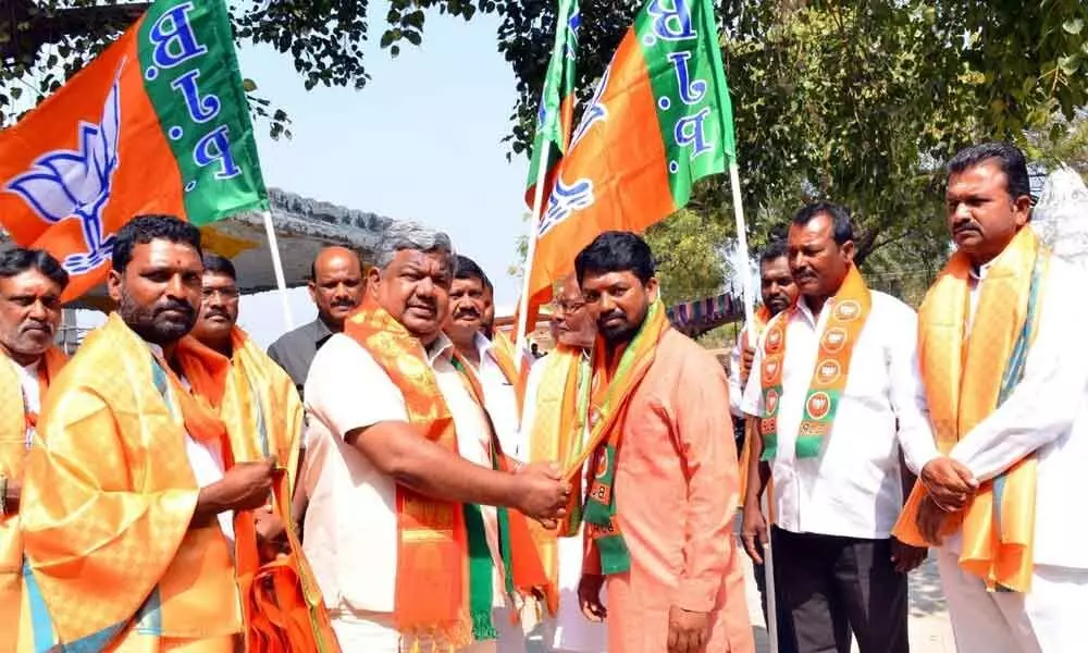 BJP leader Gudur Narayana Reddy inviting youth into the party at a programme in Padamati Somaram village on Sunday