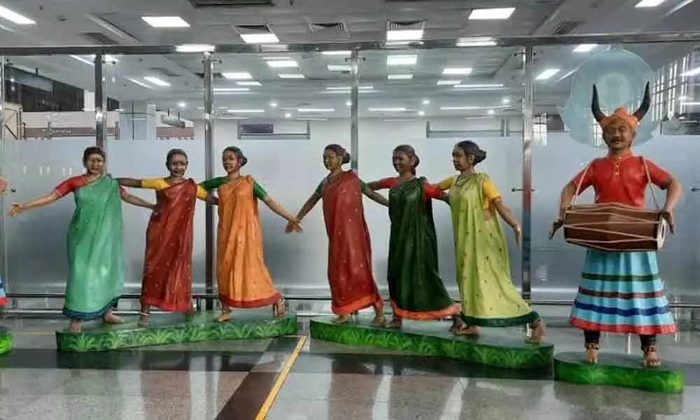 Statues of Dhimsa dance theme at Visakhapatnam airport terminal building (Bottom) Artworks reflecting tourists spots at the terminal building
