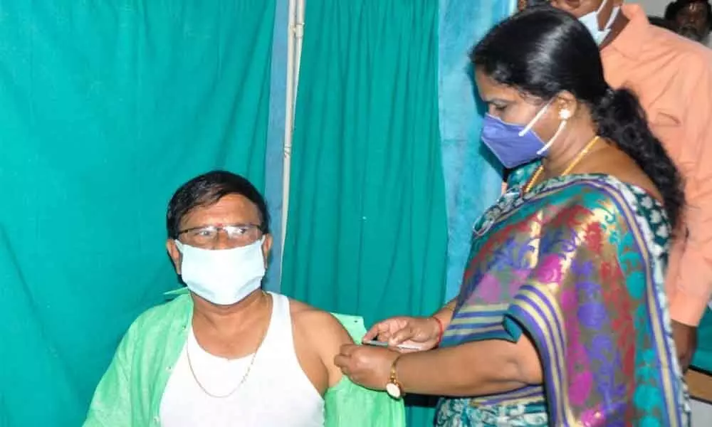 Chittoor DM&HO Dr M Penchalaiah  is getting vaccinated by DCHS  Dr P Saralamma
