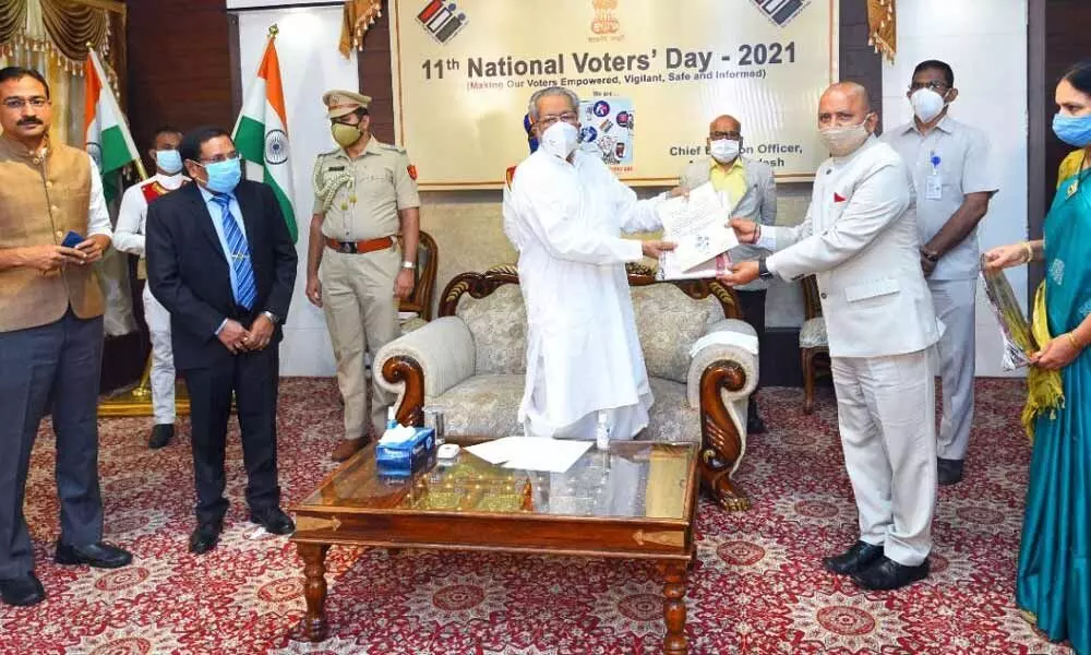Vizianagaram District Collector M Hari Jawaharlal receiving the Best District Election Officer award from Governor Biswa Bhusan Harichandan at the Raj Bhavan in Vijayawada on Monday