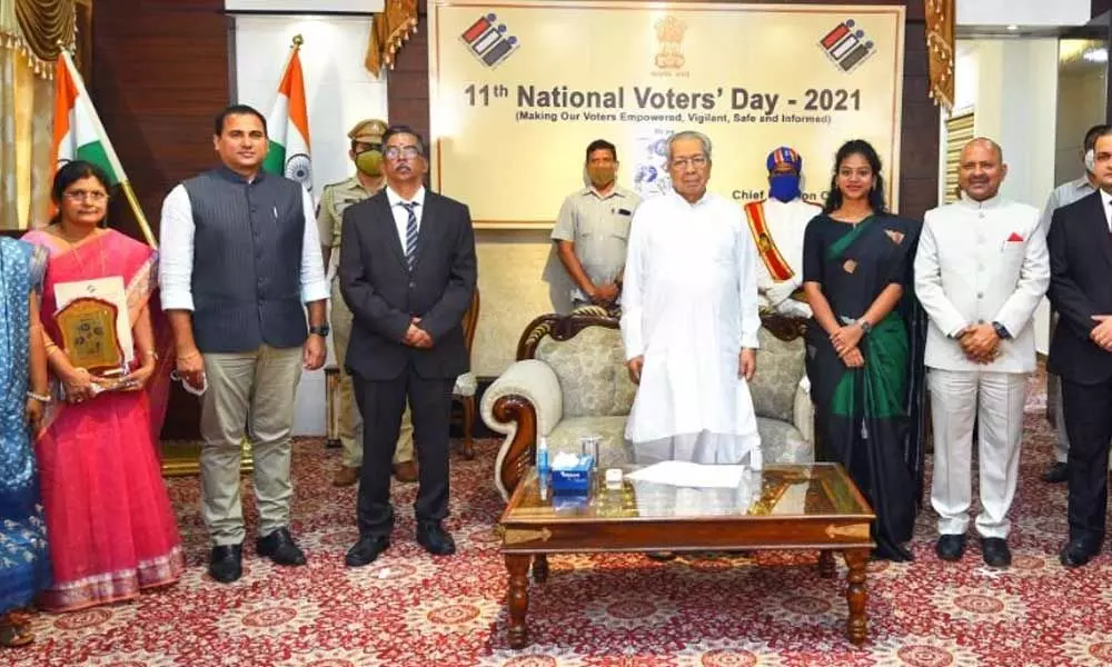 Governor Biswa Bhushan Harichandan with Chief Electoral Officer K Vijayanand, Collectors and officials at the National Voters Day programme at Raj Bhavan in Vijayawada on Monday