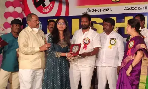 Sports and Youth Services Minister Dr V Srinivas Goud felicitating NEET rank student at a programme at Crown Garden function hall in Mahbubnagar on Monday.