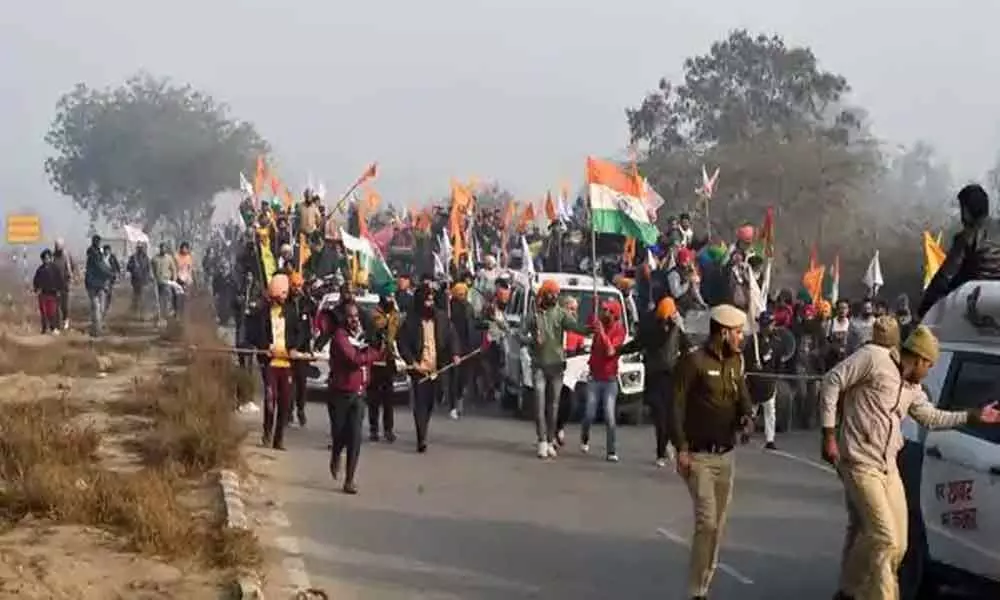 Groups of farmers at Singhu, Tikri border points enter Delhi breaking police barricade