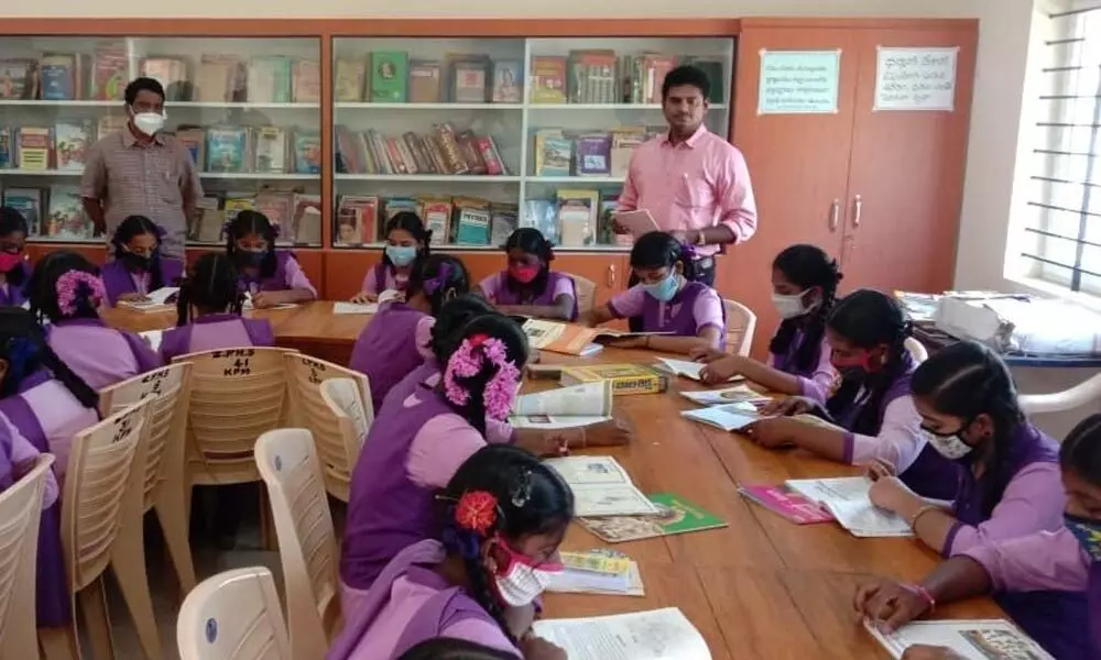 Government school students reading books during the library session
