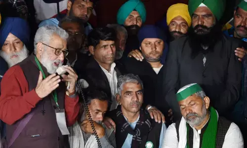 Yogendra Yadav, Rakesh Tikait and other leaders of Sanyukt Kisan Morcha during a press conference regarding the violence during tractor march, at Singhu border in New Delhi, on Wednesday