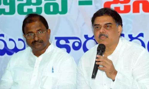Jana Sena political affairs chairman Nadendla Manohar and BJP state president and MLC Somu Veerraju addressing a press conference