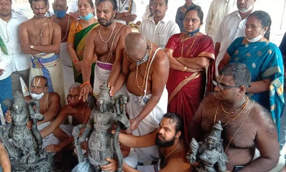Priests conducting installation ceremony for the new idols of Lord Rama, Sita and Lakshamana at Kodandarama temple in Ramatheertham on Thursday