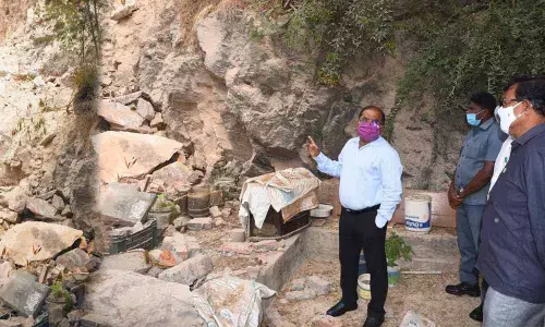 Collector A Md Imtiaz visiting the hillock area at Moghulrajapuram in Vijayawada on Thursday