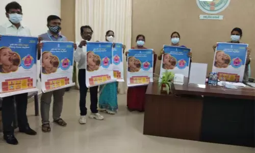 Joint Collector P Prasanti and district Task Force Committee members releasing posters relating to Pulse Polio programme in Guntur on Thursday