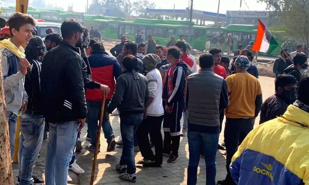 Delhis Haryana border at Singhu quickly deteriorated on Friday afternoon as villagers clashed with protesting farmers after one thing led to another and the mob was seen armed with stones, lathis, swords.