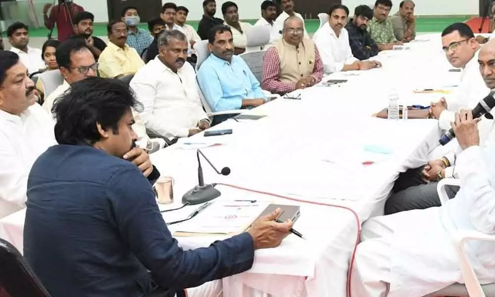 Jana Sena Party chief Pawan Kalyan with Kapu Sankshema Sena leaders at his party office in Mangalagiri on Friday