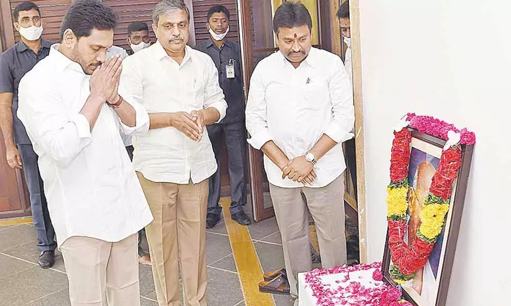 Chief Minister Y S Jagan Mohan Reddy paying tributes to Mahatma Gandhi on his death annviersary at his residence in Tadepalli