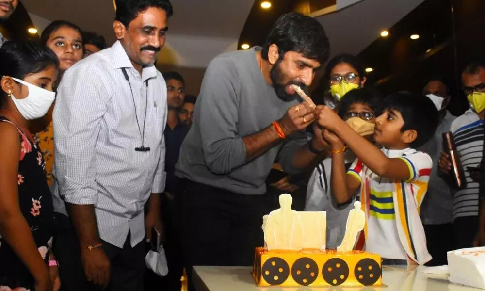Director Malineni Gopichand cutting a cake to mark the success of the movie Krack  at Capital Cinemas in Vijayawada on Sunday