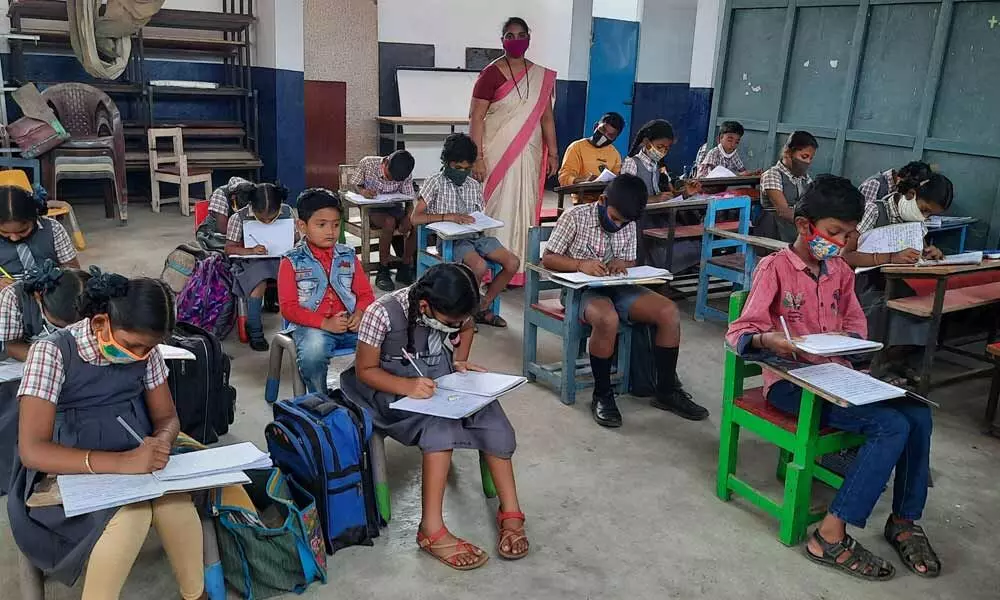 Children attending a class at Grace English Medium High School in Vijayawada on Monday